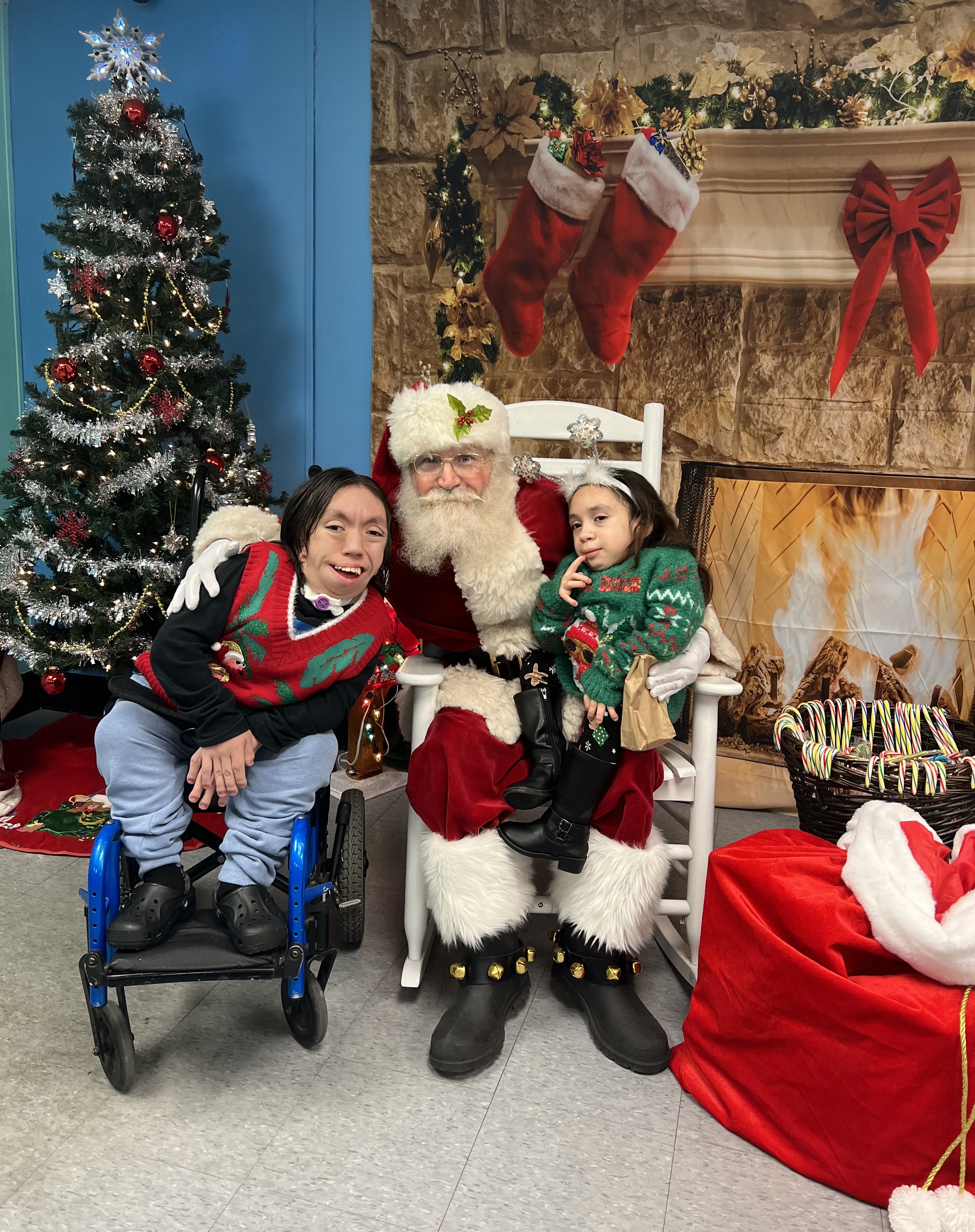 Santa sharing a joyful Christmas visit with two young guests