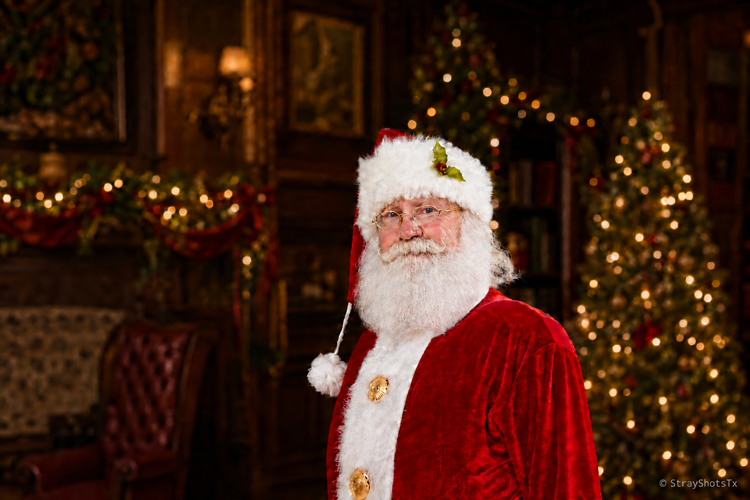 San Antonio Santa with a softly textured snowy white beard in a warmly decorated Victorian Christmas parlor